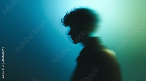 Silhouette of a man in motion against a gradient light