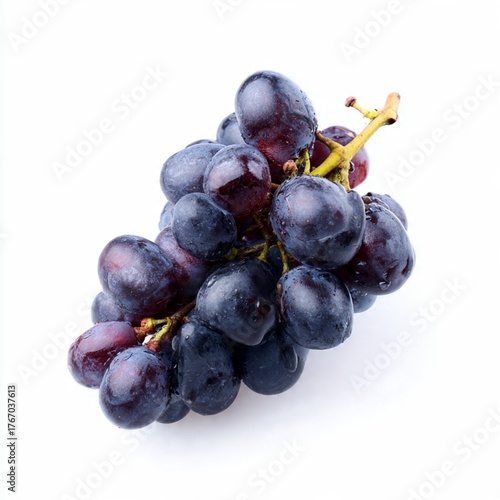 Fresh Dark Grapes Bunch with Water Droplets Isolated on White. Juicy, ripe black fruit on a vine stem.