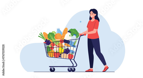 A happy woman pushing a fully loaded shopping cart filled with fresh groceries and everyday items through a supermarket aisle.