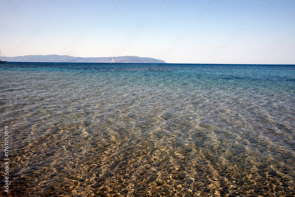 Obraz premium Kefalonia- Greece - August 15, 2025: Mounda beach needs Skala, Kefalonia, Greece.