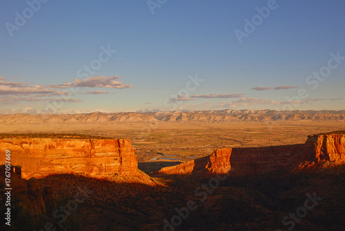 Desert Canyon Landscape at Sunrise with Valley and Mountain Range