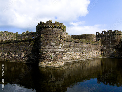 Beaumaris Castle Anglesey, North Wales. Dramatic historic ruins. UNESCO monument. Beautiful medieval castle with moat. Intact fortress walls.