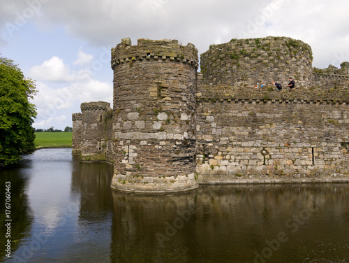 Beaumaris Castle Anglesey, North Wales. Dramatic historic ruins. Beautiful medieval castle with moat. Intact fortress walls.