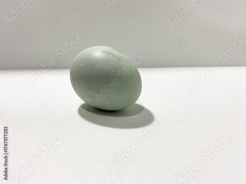 Salted egg isolated on white background. Half salted egg and whole preserved duck egg on white surface. Salted duck egg photography isolated on clean background. Boiled half and whole egg.