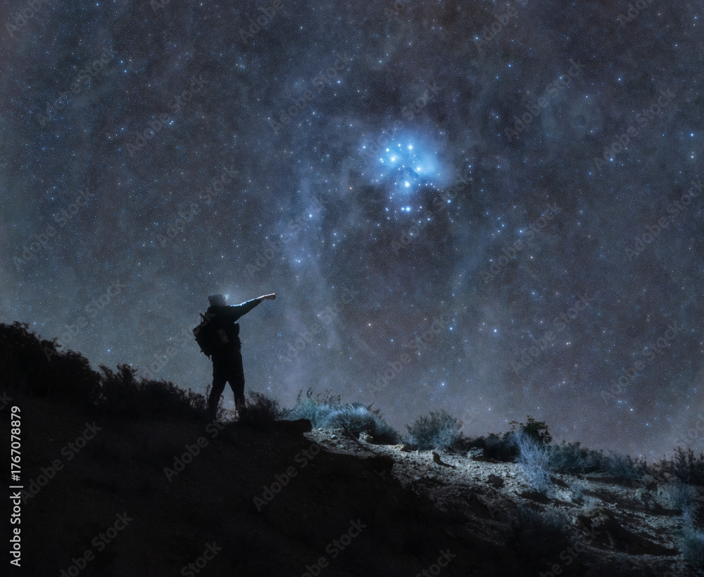 Fototapeta premium Astrophotography of Man on Mountain and Pleiades - Night landscape