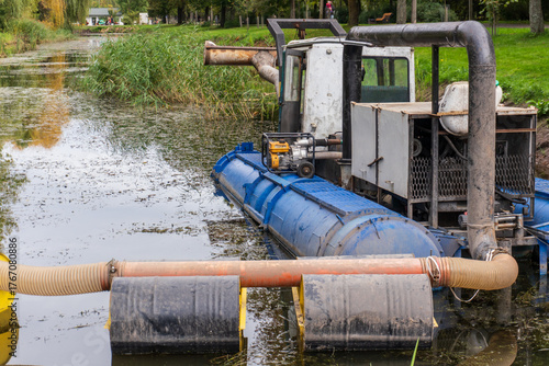 Dredging Machine in a Pond Surrounded by Greenery
