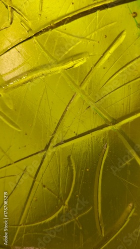 Surface of yellow stained hand blown glass artwork abstract background