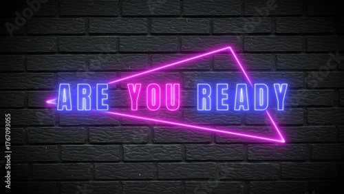 Get ready for an exciting challenge with vibrant neon text on a stylish black brick wall background, sparking anticipation and energy