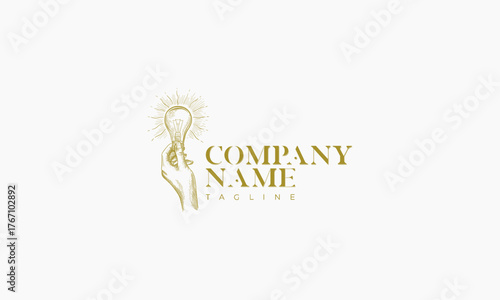 Hand Holding Glowing Lightbulb with Sunburst Design