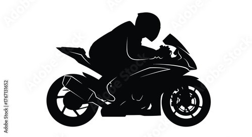 Silhouette of a motorcycle racer leaning into a fast turn