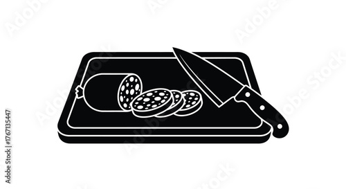 Sliced salami and a knife resting on a wooden cutting board