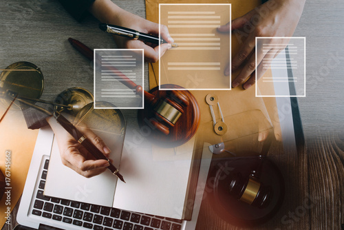Male lawyer working with contract papers and wooden gavel on tabel in courtroom. justice and law ,attorney, court judge, concept.