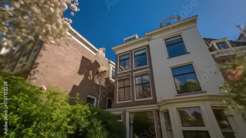 Wallpaper Mural A charming, sun-drenched courtyard garden, complete with vibrant blossoms and outdoor dining. Torontodigital.ca