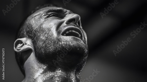 Strained Expression: A captivating portrait of an individual in intense struggle, their face etched with emotion, highlighting determination and the depth of the human experience.