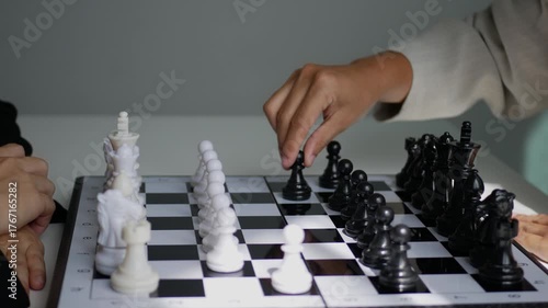 Two business women play a game of chess to be a concept of business competition and problem solving For always good results.	