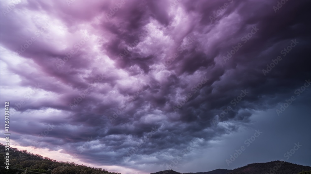 Obraz premium midgard. Dark purple storm clouds gathering before rainfall, dramatic sky formation, natural weather phenomenon. travel magazines, destination branding, designed for travel destination branding.