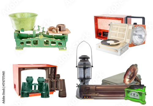 grouping of disparate vintage objects including an antique kitchen scale, a wooden radio, old television, binoculars, and a kerosene lantern, isolated on black.