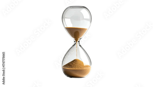 A clear glass hourglass with brown sand partially drained, set against a stark black background