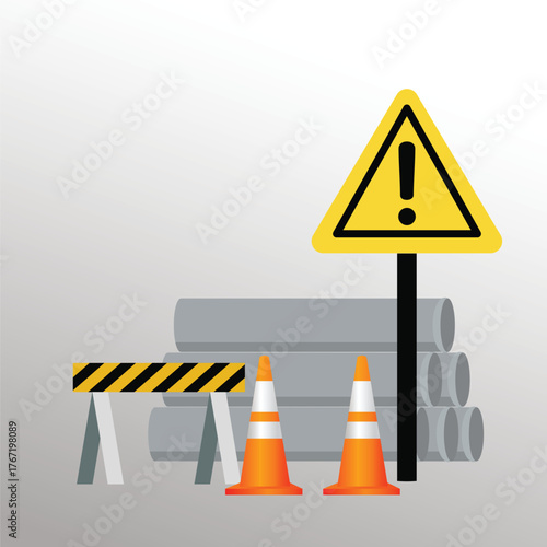 A construction zone is marked with a safety sign, cone, and hard hat