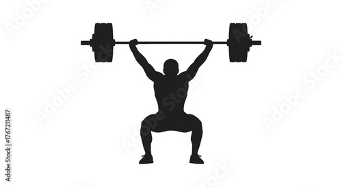 Silhouette of a man performing a powerful overhead squat with a heavy barbell in a gym setting