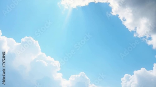 Celestial Embrace: A captivating vista of a radiant azure sky, adorned with fluffy, cotton-like clouds, creating a sense of serenity and infinite vastness.