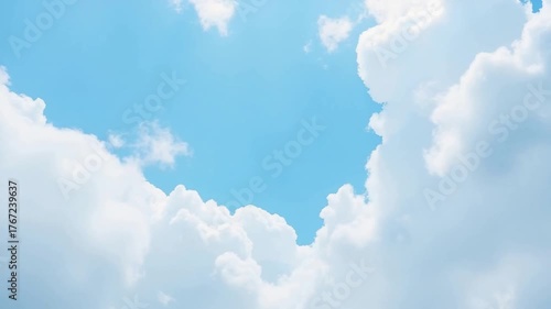 Cloudscape: A serene expanse of a cerulean sky adorned with fluffy, cotton-like clouds, creating a sense of peace and vastness.