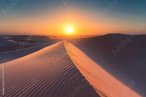 Fototapeta Naklejka Na Ścianę i Meble -  Sand dunes forming perfect lines leading toward a setting sun