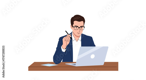 A young businessman in glasses and a suit jacket working thoughtfully at his desk with a laptop.