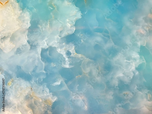 Close up of antique blue marble emperador with random white veins. Rare light blue marble suitable for elegance and luxurious interior design finishes. Minerals stone. Seamless background texture. 