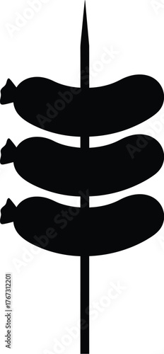 Three black sausage links impaled on a sharp metal skewer