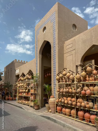 Aesthetic building entrance decorated with tradional clay pots, Nizwa, Oman.