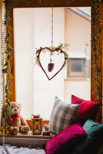 Living room interior. Christmas tree and wreath. New Year celebration. Vacation rentals. Winter holidays and vacations