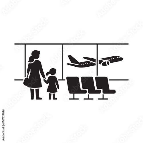 Mother and child waiting for airplane at airport terminal window