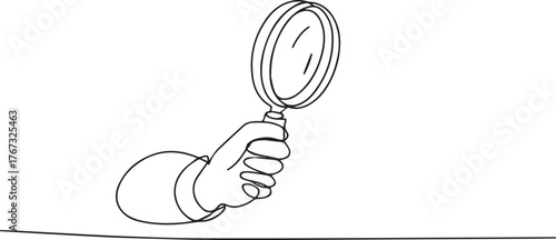 Vector art of hand holding a magnifying glass