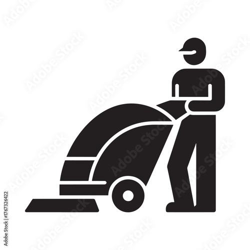 Silhouette of a person operating a floor cleaning machine