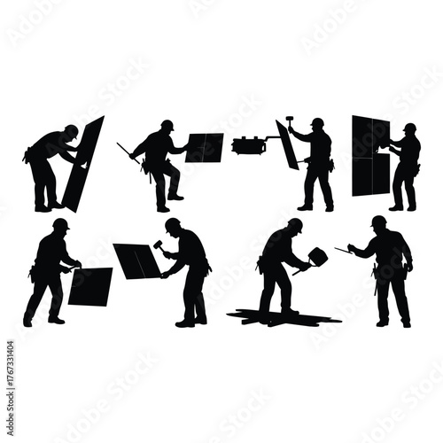 Silhouette of construction workers installing tiles hard work in progress