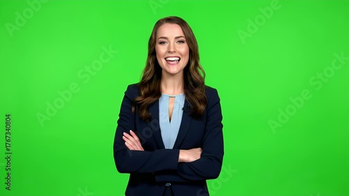 Confident Young Professional Woman in Business Suit Smiling with Arms Crossed Against Green Screen Background, Ideal for Chroma Key Compositing