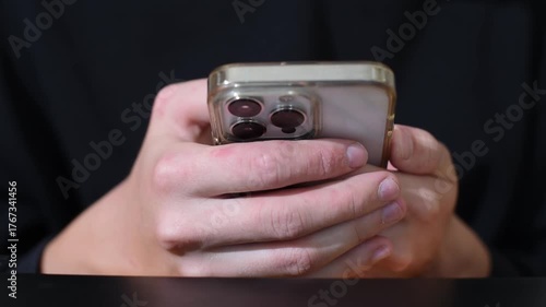 Fingers of a man pressing smartphone screen, texting, having fun  and working online. Horizontal video, business theme . Gadgets in teenager's hands . 