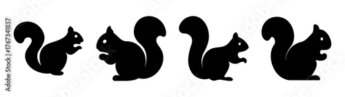 Four silhouette squirrels in different poses with fluffy tails and nibbling