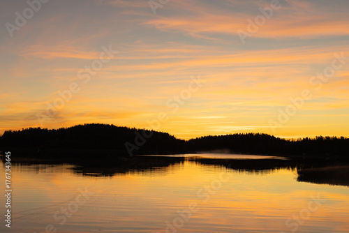 Wallpaper Mural Golden sunrise over calm autumn sea with forest on the shore and gentle fog above the water, peaceful natural seascape and morning atmosphere Torontodigital.ca