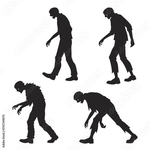 Silhouette of four menacing zombies walking and lurking with tattered clothing in a dark and creepy halloween scene