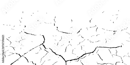 Cracked dry earth surface showing drought and arid land pattern. High-contrast black and white cracked soil background ideal for climate change, desertification, and natural texture design.

