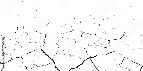 Cracked dry earth surface showing drought and arid land pattern. High-contrast black and white cracked soil background ideal for climate change, desertification, and natural texture design.

