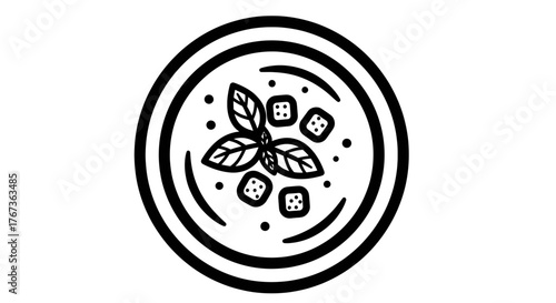 Delicious bowl of soup with basil leaves and croutons top view.