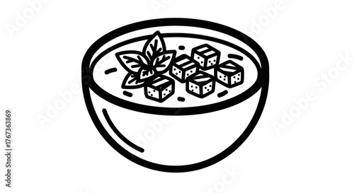 Delicious soup with fresh basil and tofu cubes a culinary delight.