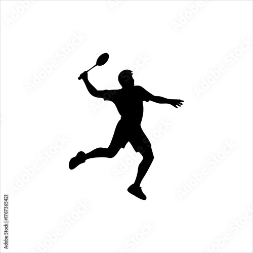 Silhouette of a male badminton player in action hitting a shuttlecock