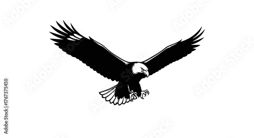 A powerful bald eagle spreads its wings wide as it soars through the sky with its talons extended.