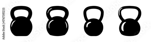 Four shiny black kettlebells lined up ready for weight training workouts