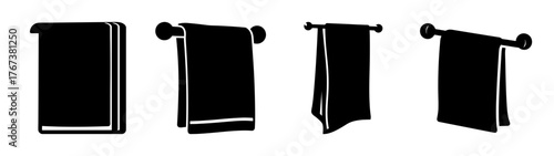 Four black towels displayed on a rod different hanging styles fabric texture detail