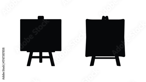Two black easels displaying empty surfaces for art or presentation